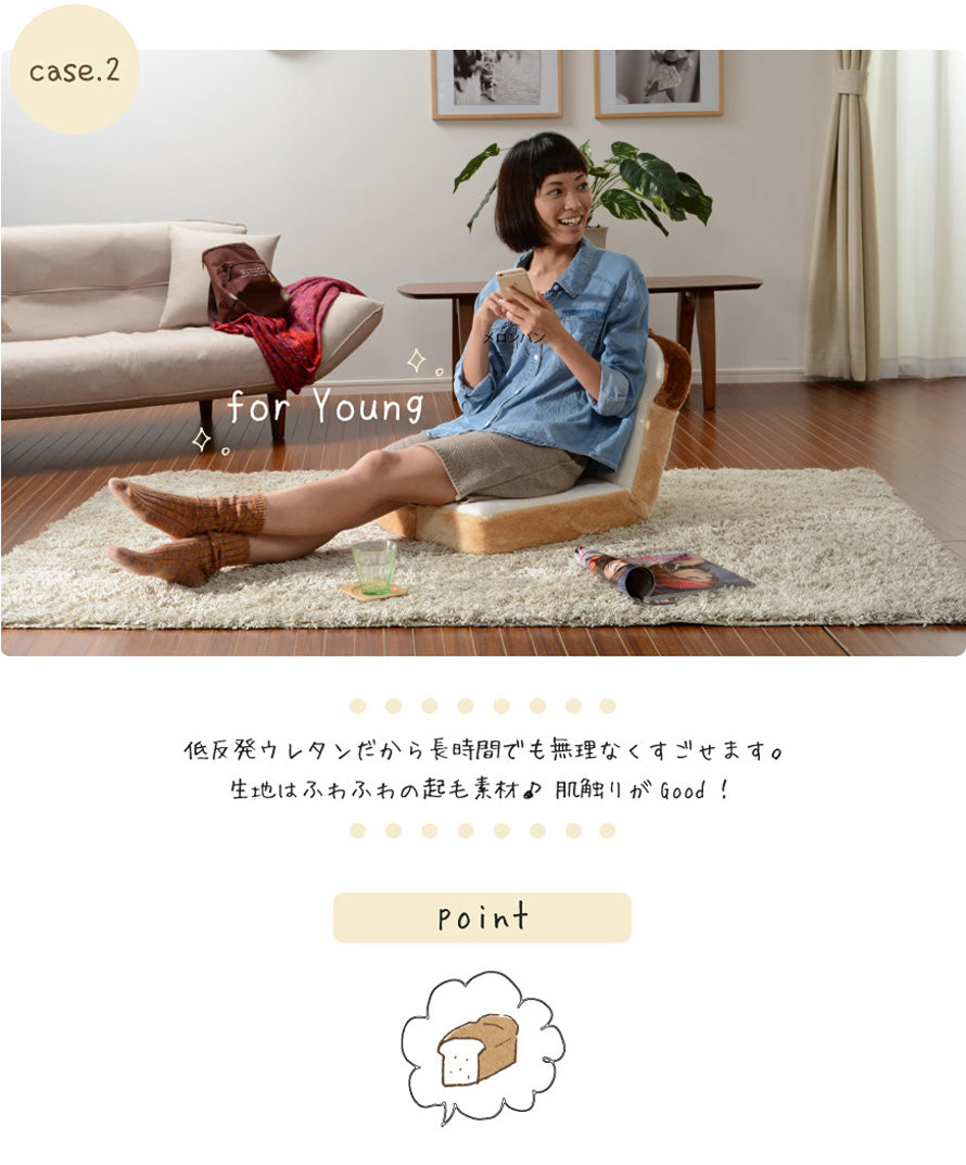 A brown colored chair in the shape of a bread loaf, with cushioning foam and steel pipes for support.