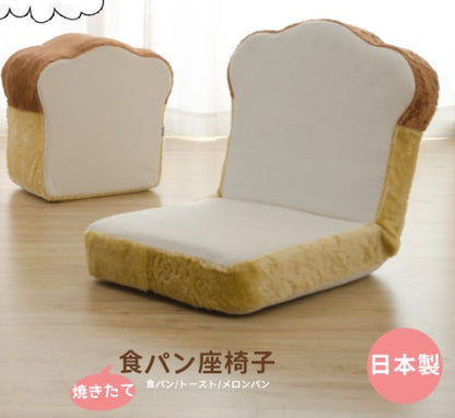 A brown colored chair in the shape of a bread loaf, with cushioning foam and steel pipes for support. 